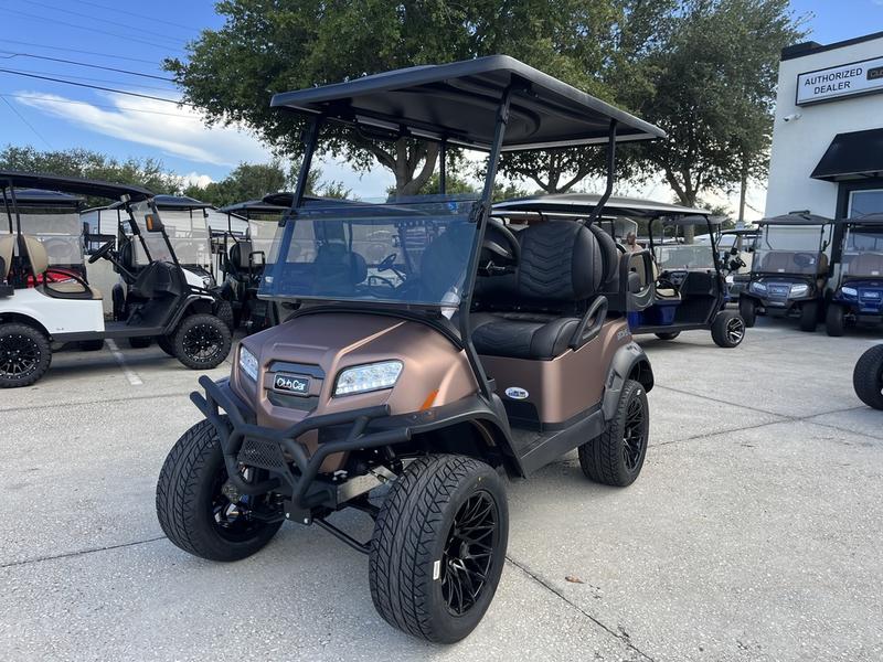 Side view of 2025 Club Car Onward Lifted 4 Passenger XR Lithium golf cart in Austin Texas