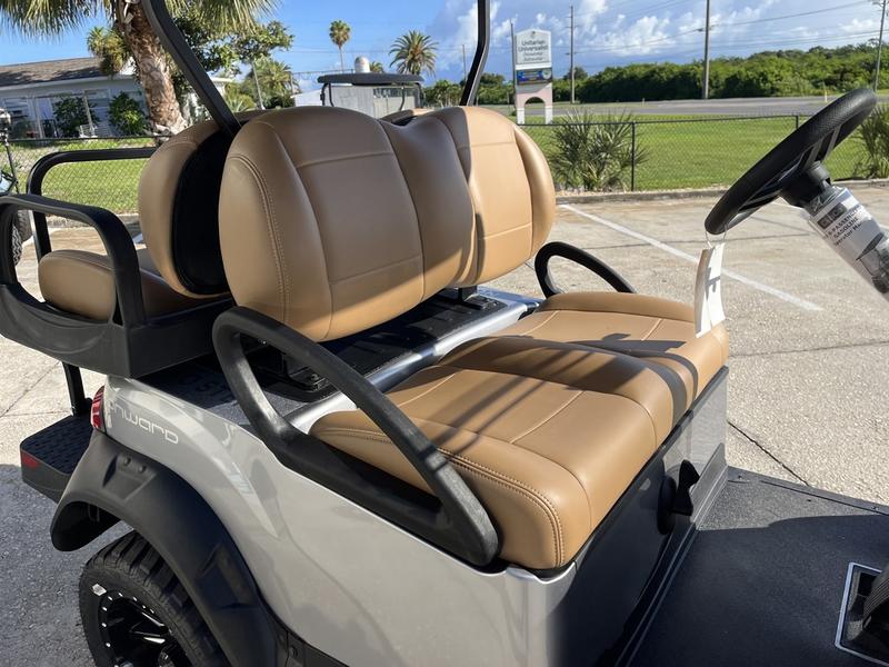 Four-passenger premium seating inside 2026 Club Car Onward Lifted Gas grey Texas