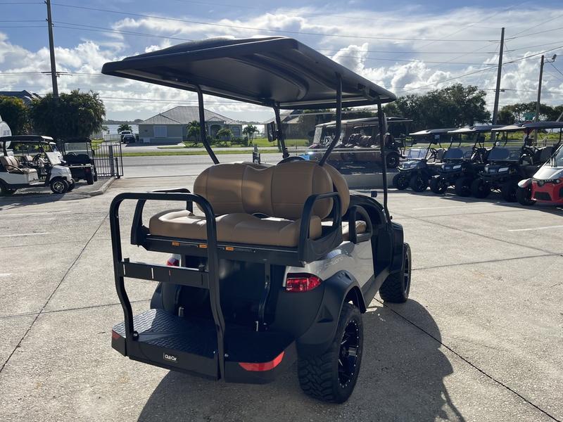 Rear fold-down seat and cargo platform on 2026 Club Car Onward Lifted Gas grey Texas