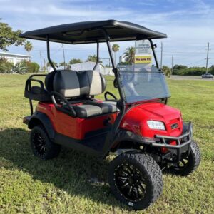 Luxury four-passenger seating inside 2026 Club Car Onward Lifted Gas red California