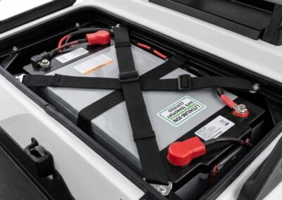 Secured lithium-ion battery pack with X-pattern nylon tie-downs for safe transport.